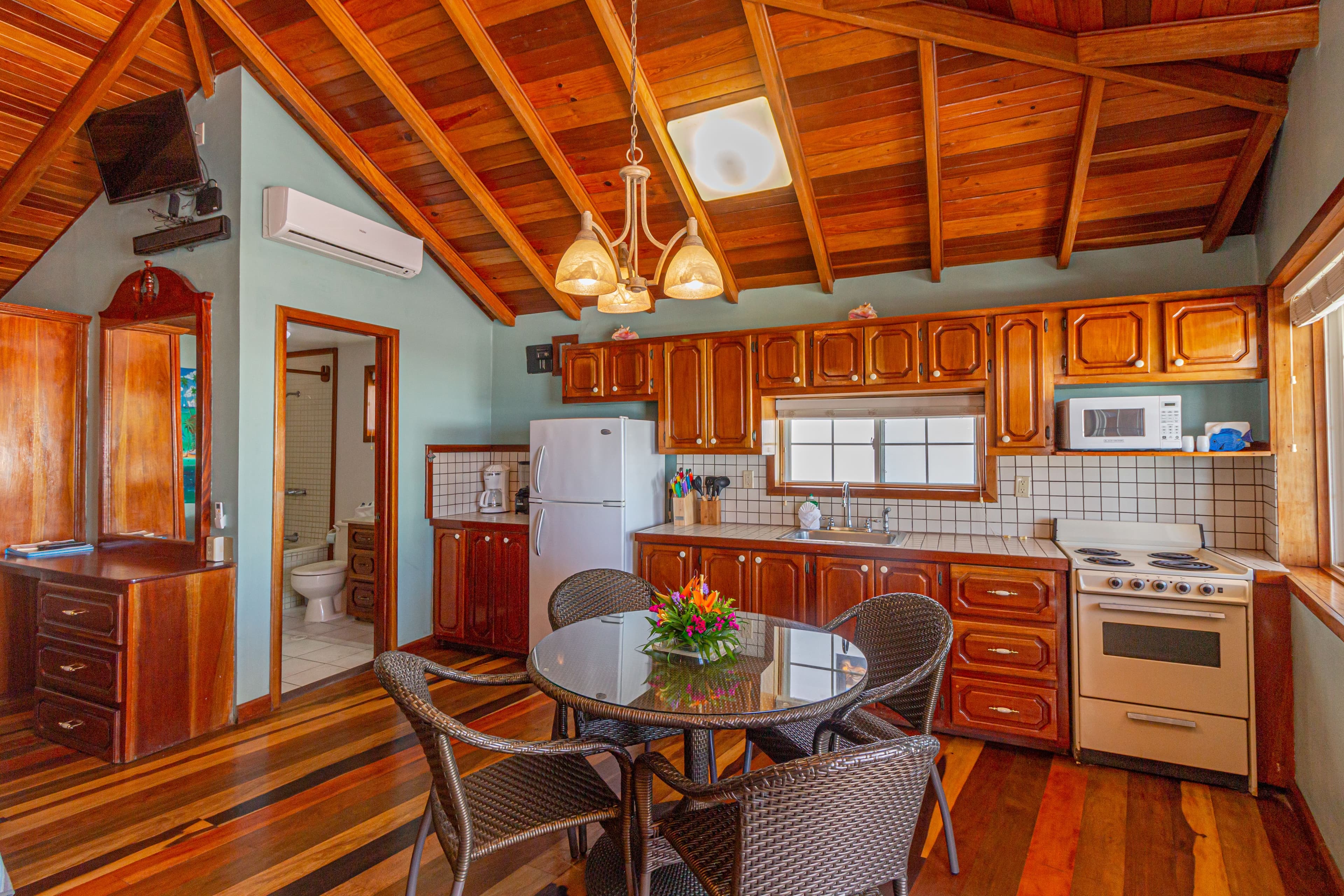 Suite with fully equipped kitchen, dining table, 4 chairs, futon, vaulted wood ceilings and wood floor