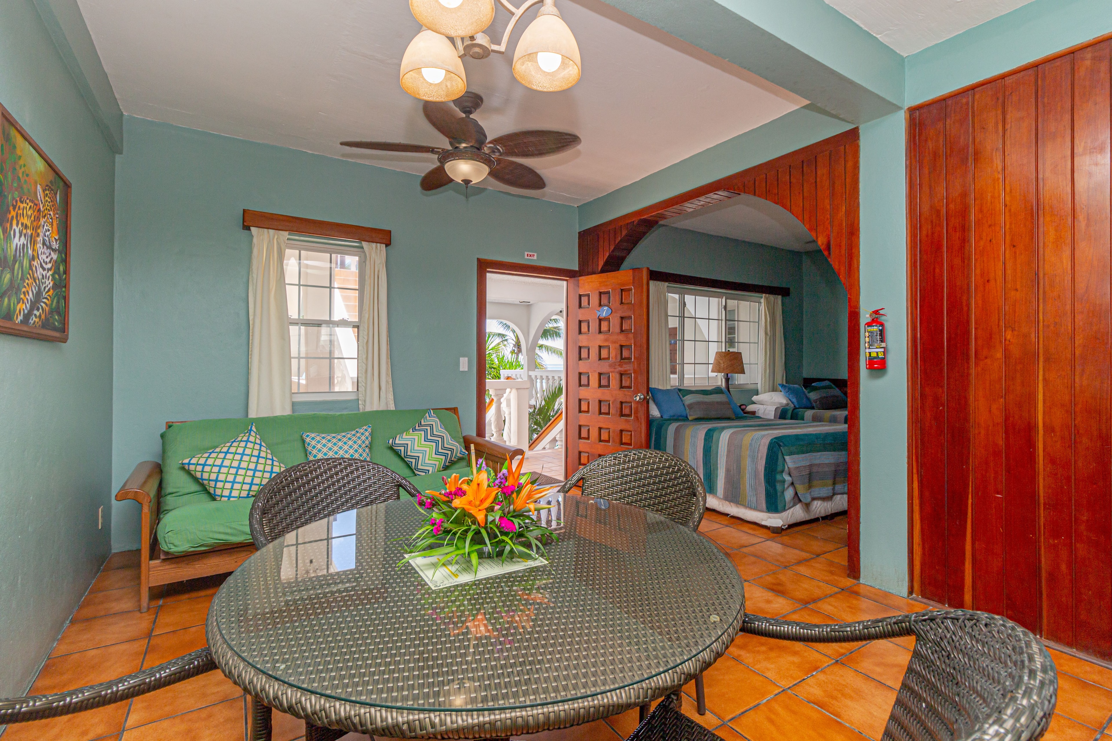 The suite has 2 double beds, futon, fully equipped kitchen, a/c, ceiling fans TV with Cable and WiFi.
