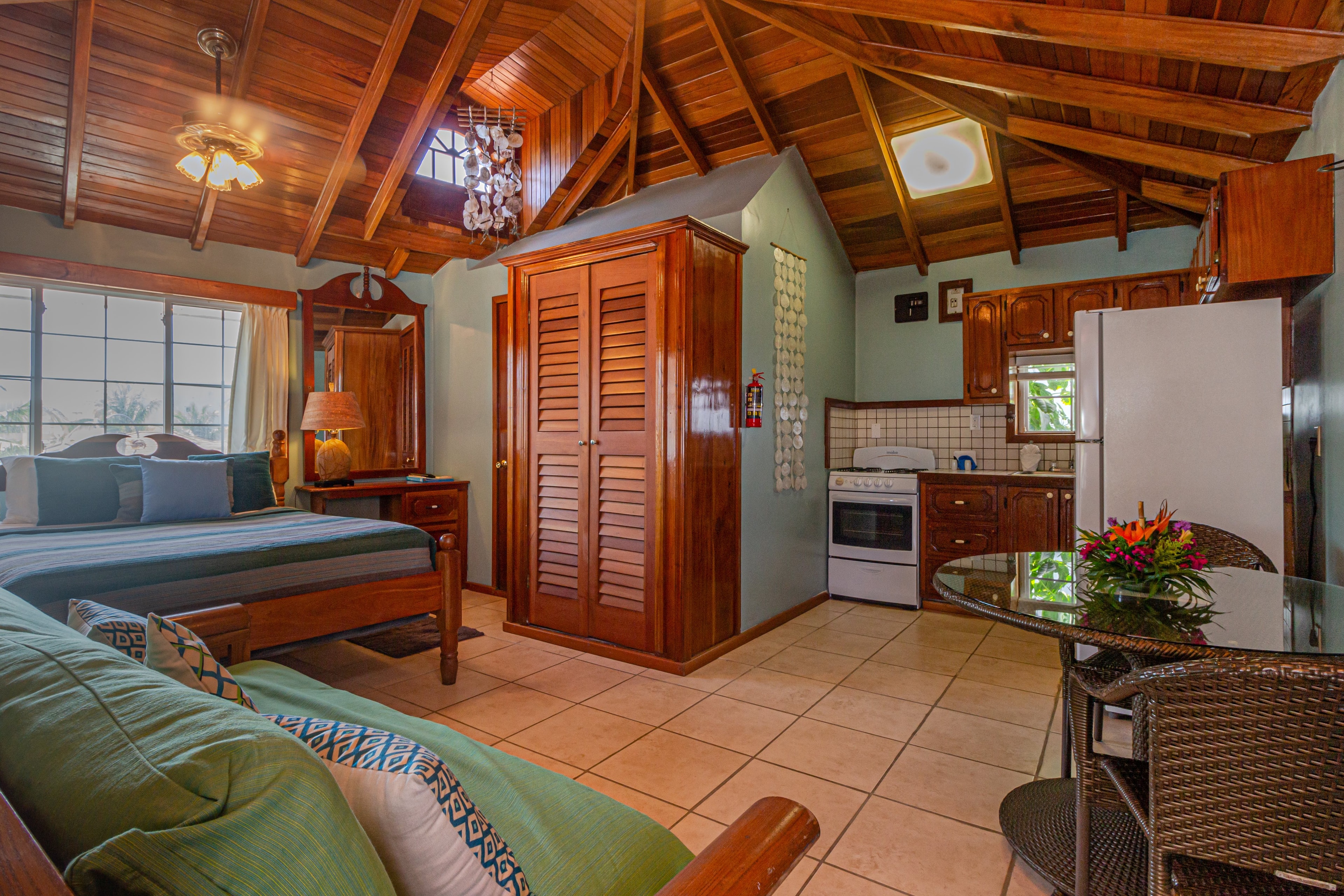 The suite has king bed, futon, vaulted ceilings, fully equipped kitchen, a/c, ceiling fans TV with Cable and WiFi.