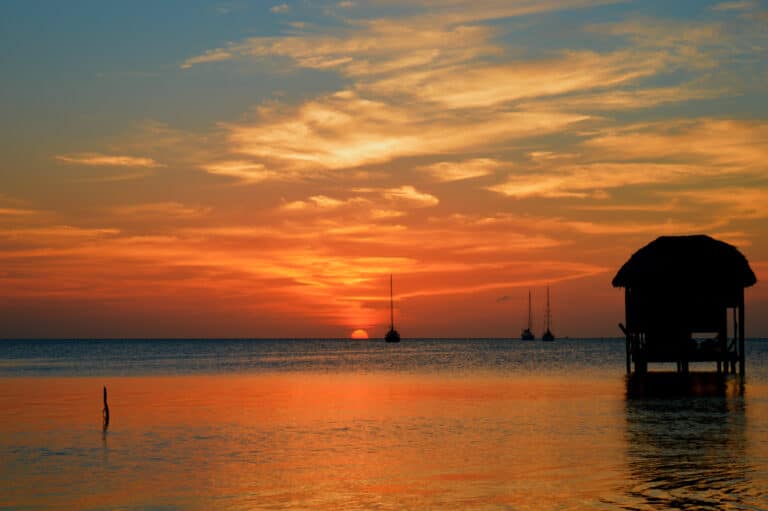 A stunning sunset over Ambergris Caye - one of the many reasons this is the best places to plan a caribbean vacation for couples