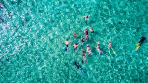 Aerial view of people snorkeling on the Belize Reef