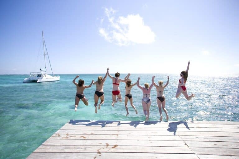 Group of friends and family enjoy the best Belize vacation packages at our San Pedro, hotel